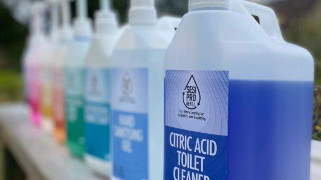 A row of SESI bulk containers with pumps, showcasing a selection of their eco-friendly cleaning products. These refillable options highlight SESI’s commitment to zero-waste living and sustainable practices.